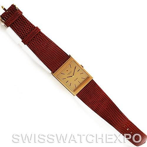 This image shows a top-down view of a Rolex Cellini 4027 Men
s Yellow Gold Champagne Dial 4027 Men
s Yellow Gold Champagne Dial watch with a rectangular dial and a brown leather strap.