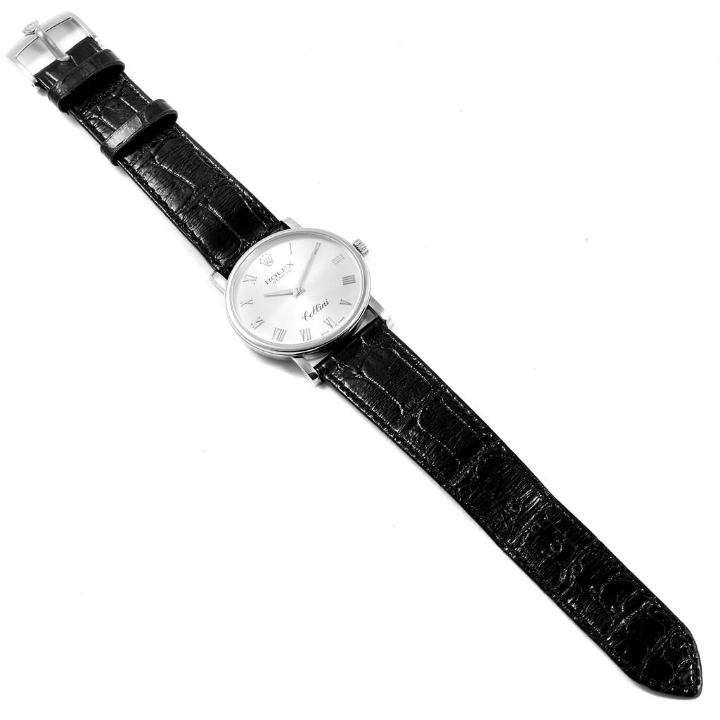 The Rolex Cellini 5115 Men's White Gold Silver Dial 5115 Men's White Gold Silver Dial watch is shown from an overhead angle, displaying the dial, strap, and buckle.