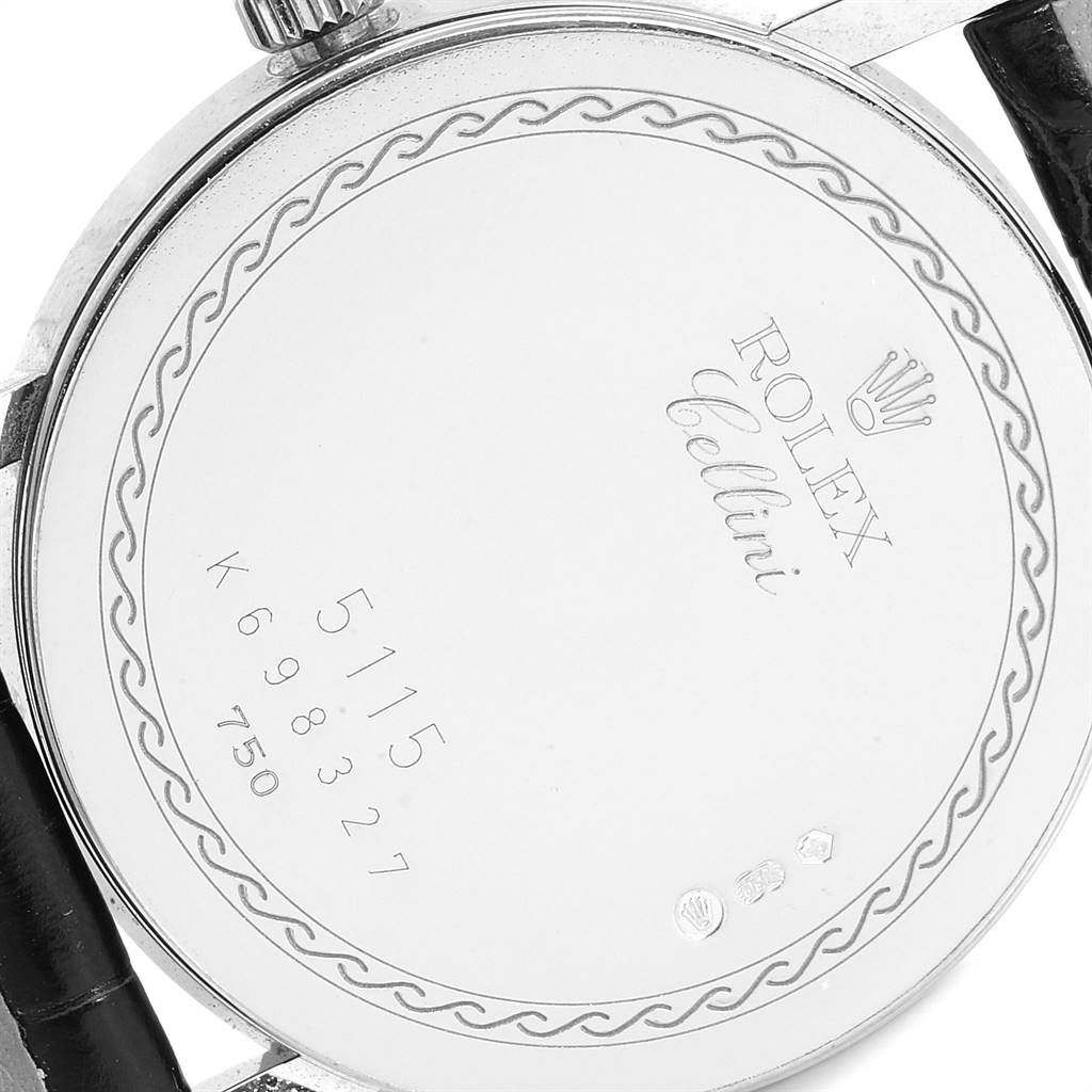 The image shows the back case of a Rolex Cellini 5115 Men's White Gold Silver Dial 5115 Men's White Gold Silver Dial watch at a slight angle, displaying engraved details.