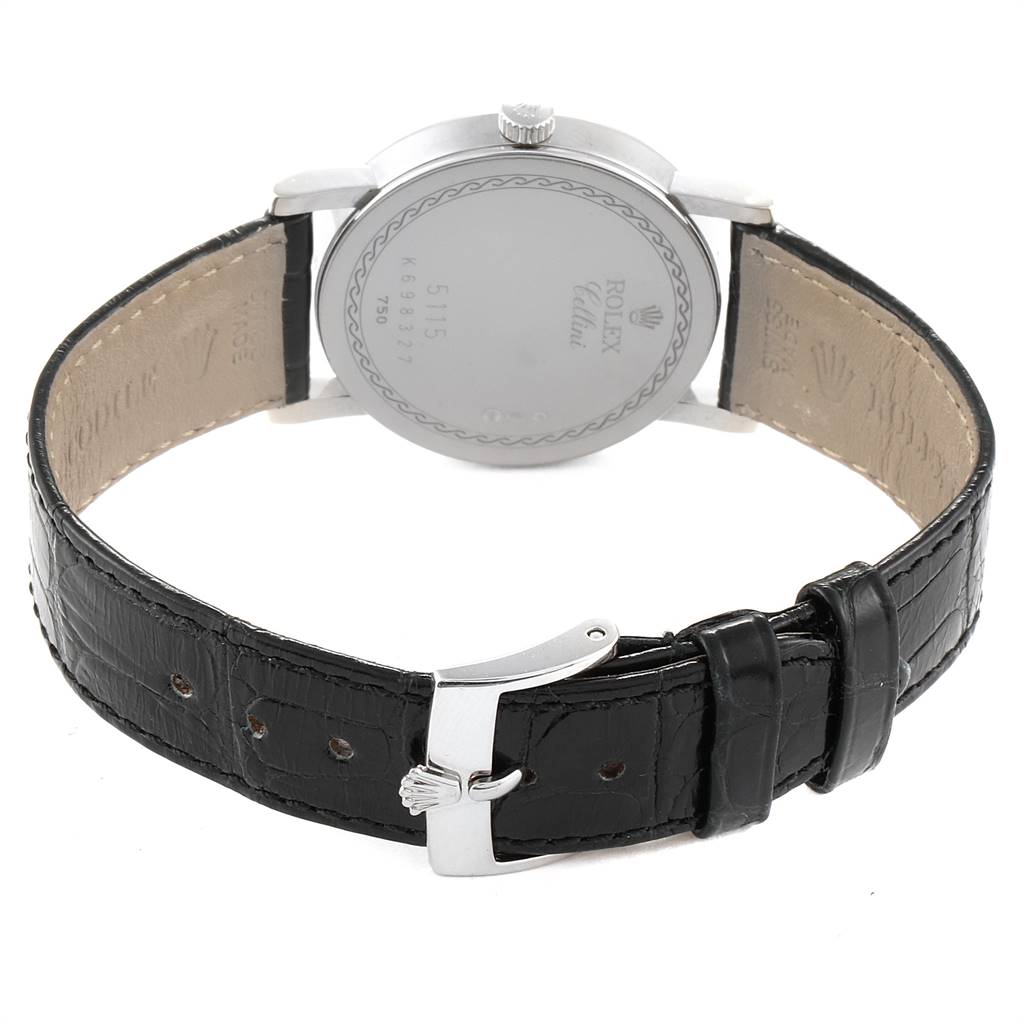 The image shows the back view of a Rolex Cellini 5115 Men's White Gold Silver Dial 5115 Men's White Gold Silver Dial watch and its black leather strap with a silver buckle.