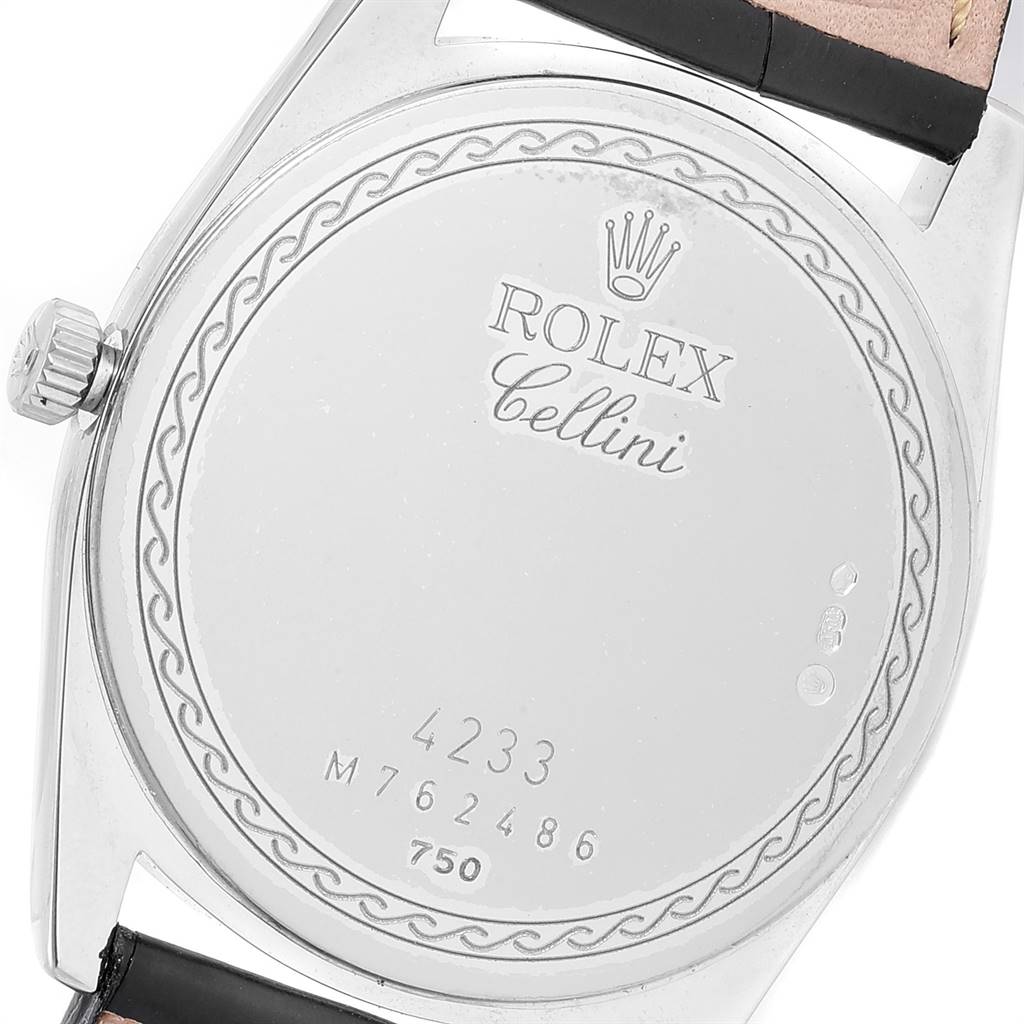 The image shows the back case of a Rolex Cellini 4233 Men's White Gold Black Dial 4233 Men's White Gold Black Dial watch, highlighting its crown and part of the leather strap.
