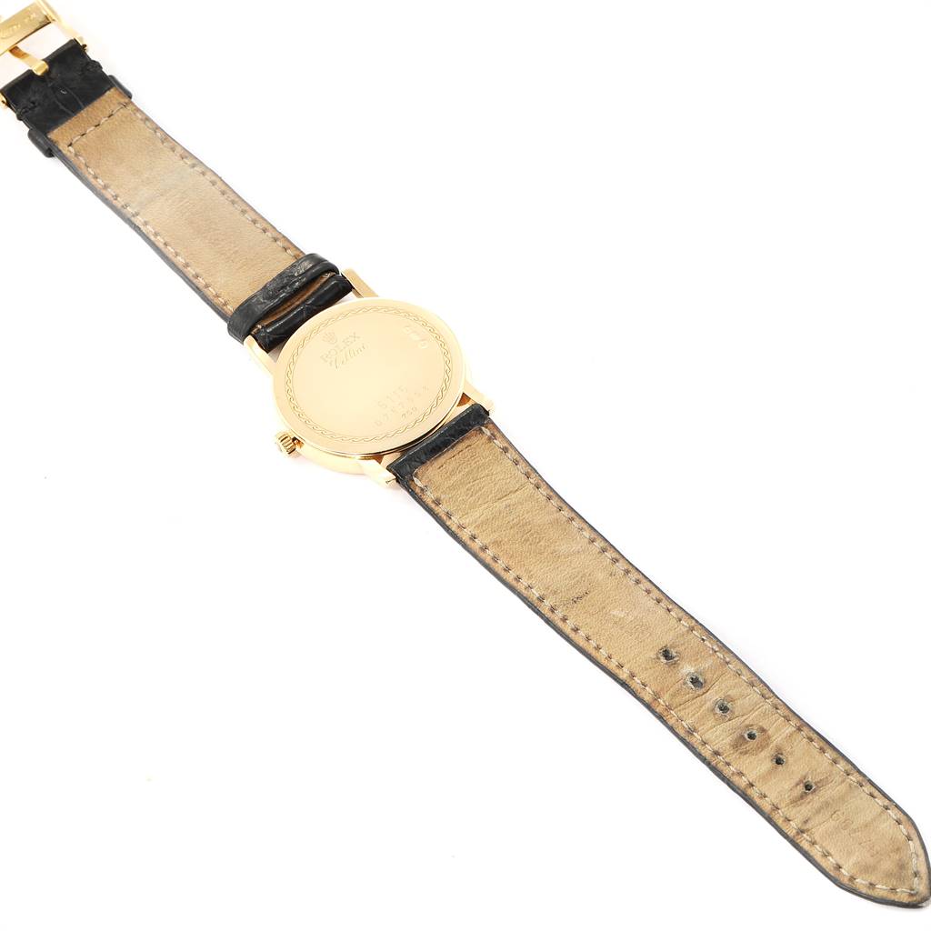 The image shows the backside and the strap of a Rolex Cellini 5115 Men's Yellow Gold Beige Dial 5115 Men's Yellow Gold Beige Dial watch laid flat.
