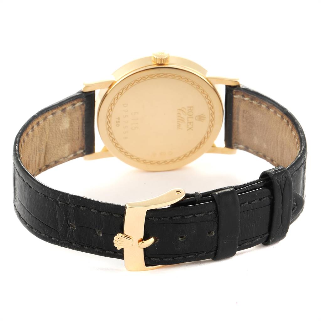 The image shows the back of a Rolex Cellini 5115 Men's Yellow Gold Beige Dial 5115 Men's Yellow Gold Beige Dial watch, highlighting its case back, crown, and black leather strap with a gold buckle.