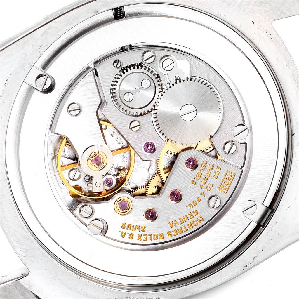 This image shows the internal mechanics and movement of a Rolex Cellini 4233 White Gold Black Dial 4233 White Gold Black Dial watch, highlighting its intricate gears and components.