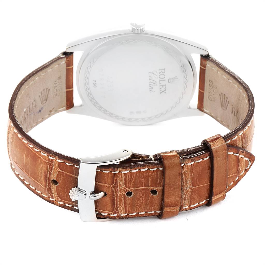 The image shows the back of a Rolex Cellini 4233 White Gold Black Dial 4233 White Gold Black Dial watch with its brown leather strap and deployment clasp visible.