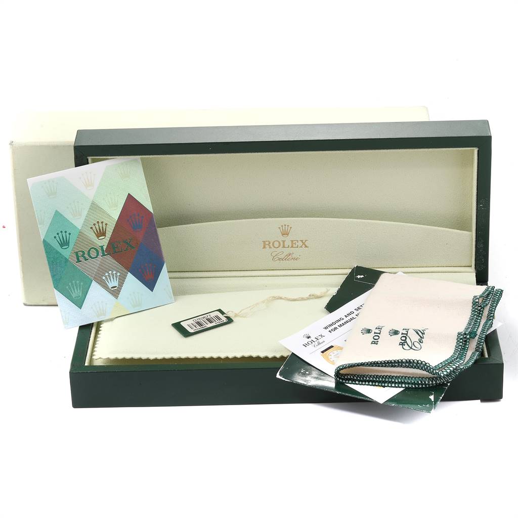 This image shows the open packaging including the box, tags, booklets, and a cleaning cloth for a Rolex Cellini 4233 White Gold Black Dial 4233 White Gold Black Dial watch.