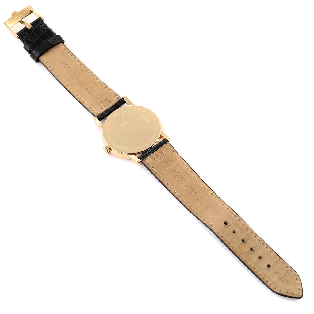 The image shows the back view of a Rolex Cellini 5115 Men's Yellow Gold Silver Dial 5115 Men's Yellow Gold Silver Dial watch, highlighting the leather strap and the case back.