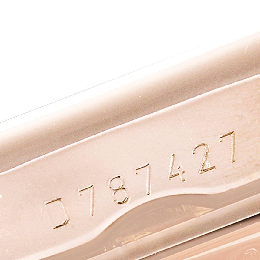 The image shows a close-up of the serial number on the edge of the case of a Rolex Cellini 5442/5 Men's Rose Gold Black Dial 5442/5 Men's Rose Gold Black Dial model watch.
