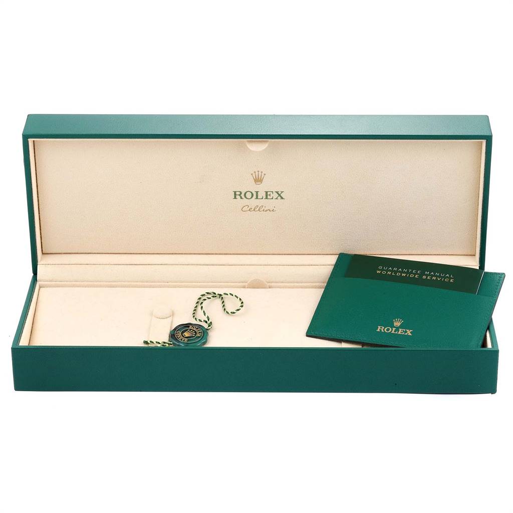 The image shows the open box for a Rolex Cellini 5241 Men's Platinum Blue Dial 5241 Men's Platinum Blue Dial watch, displaying the guarantee manual and a green tag.