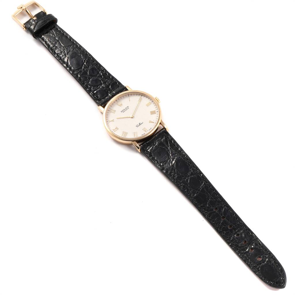 The Rolex Cellini 5112 Men's Yellow Gold Beige Dial 5112 Men's Yellow Gold Beige Dial watch is displayed flat, showing the face, case, crown, and both sections of the black leather strap with a gold buckle.