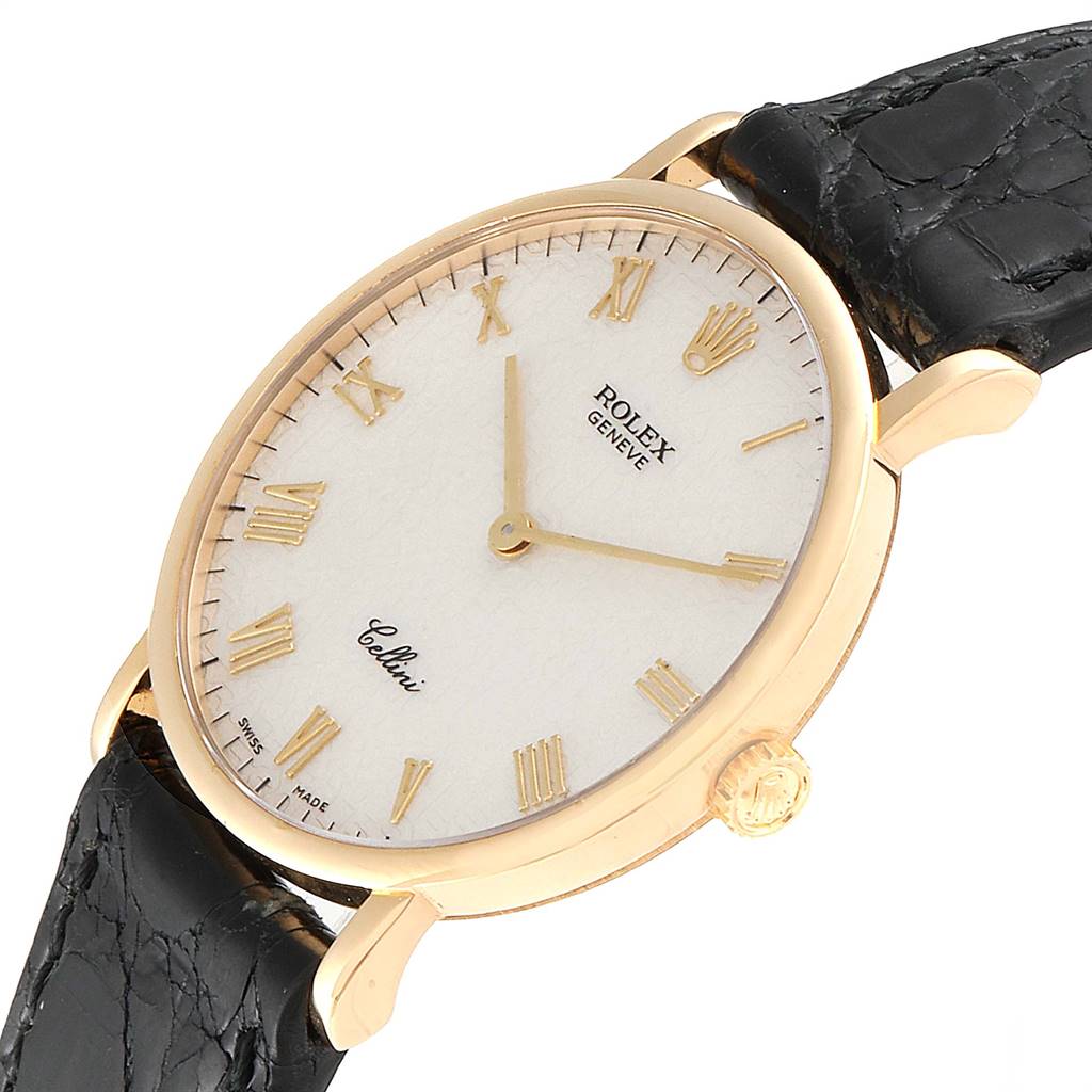 The Rolex Cellini 5112 Men's Yellow Gold Beige Dial 5112 Men's Yellow Gold Beige Dial watch is shown at an angled view, highlighting the face, case, crown, and part of the leather strap.