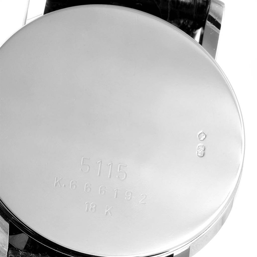 The image shows the back case of a Rolex Cellini 5115 Men
s White Gold Black Dial 5115 Men
s White Gold Black Dial watch, displaying the model number and hallmark engravings.