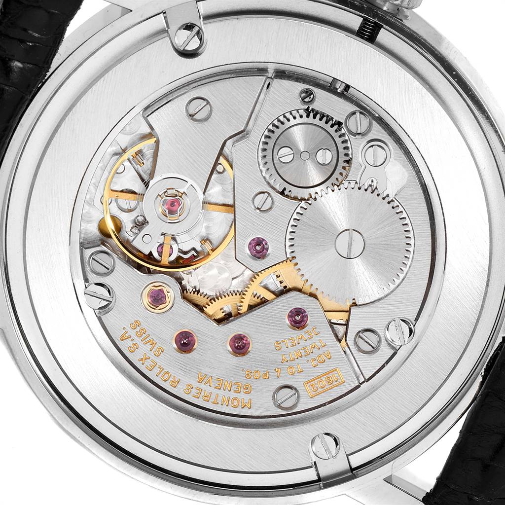 The image shows the back view of a Rolex Cellini 5115 Men
s White Gold Black Dial 5115 Men
s White Gold Black Dial model watch, highlighting its intricate mechanical movement.