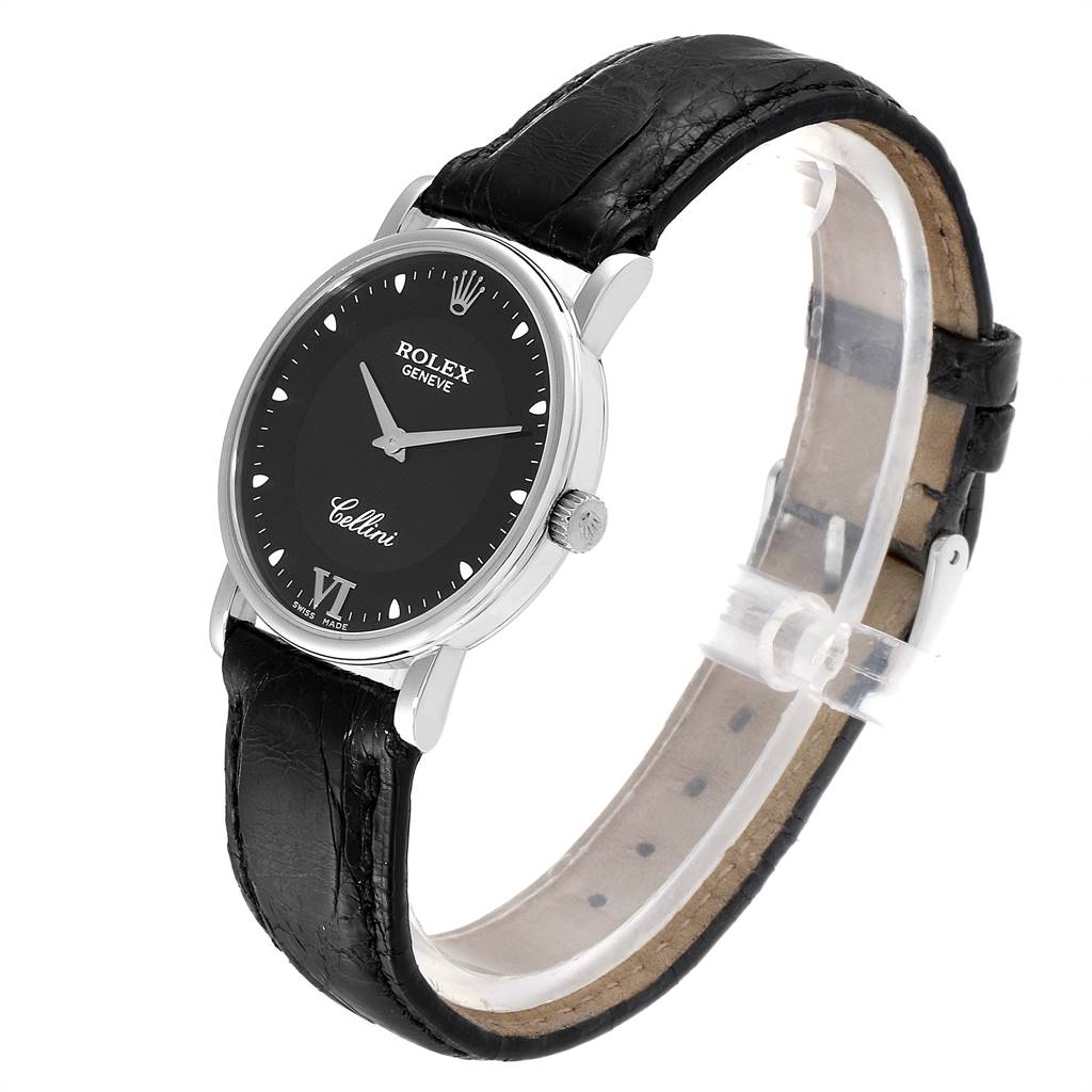 The image shows a Rolex Cellini 5115 Men
s White Gold Black Dial 5115 Men
s White Gold Black Dial wristwatch from a slightly angled top view, displaying its black leather strap and black dial.