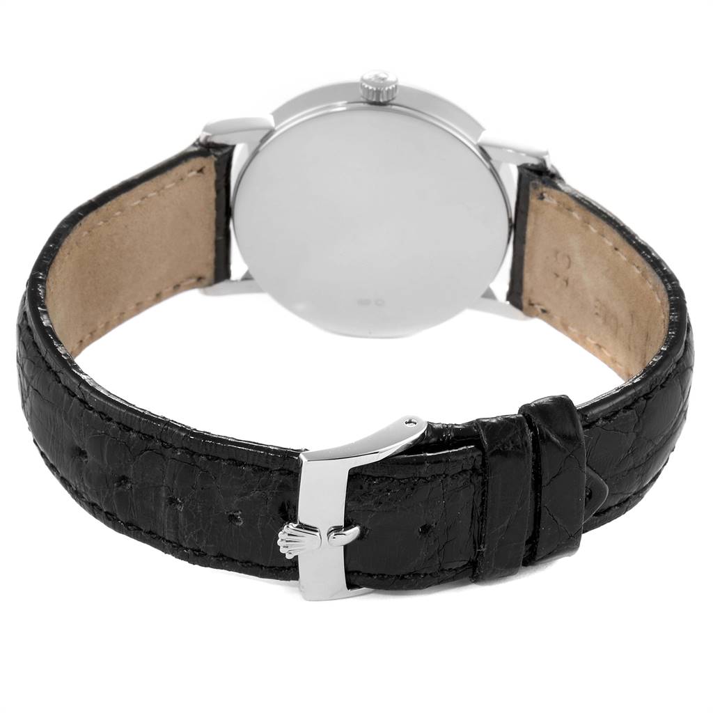 This image shows the back view of a Rolex Cellini 5115 Men
s White Gold Black Dial 5115 Men
s White Gold Black Dial watch, highlighting the leather strap and clasp.