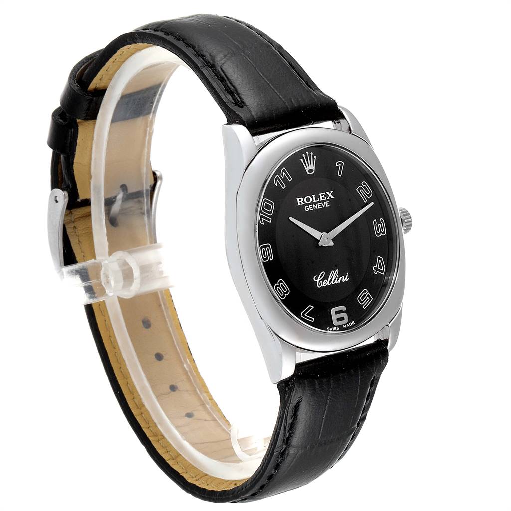 The image shows a Rolex Cellini 4233 Men's White Gold Black Dial 4233 Men's White Gold Black Dial watch at an angled side view, highlighting its black leather strap and black dial with silver numerals.