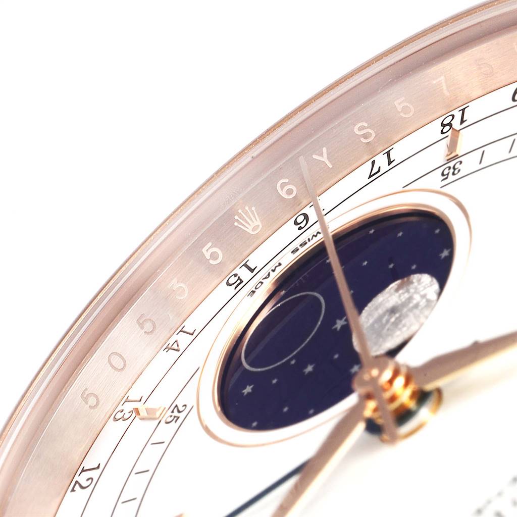 The image shows a close-up of the dial of a Rolex Cellini 50535 Men
s Rose Gold White Dial 50535 Men
s Rose Gold White Dial watch, highlighting the moonphase, numbers, and hour markers.