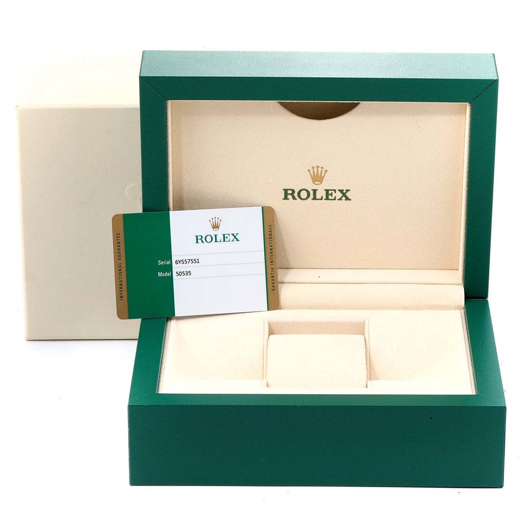 The image shows an open Rolex Cellini 50535 Men
s Rose Gold White Dial 50535 Men
s Rose Gold White Dial watch box and a warranty card from a front angle.