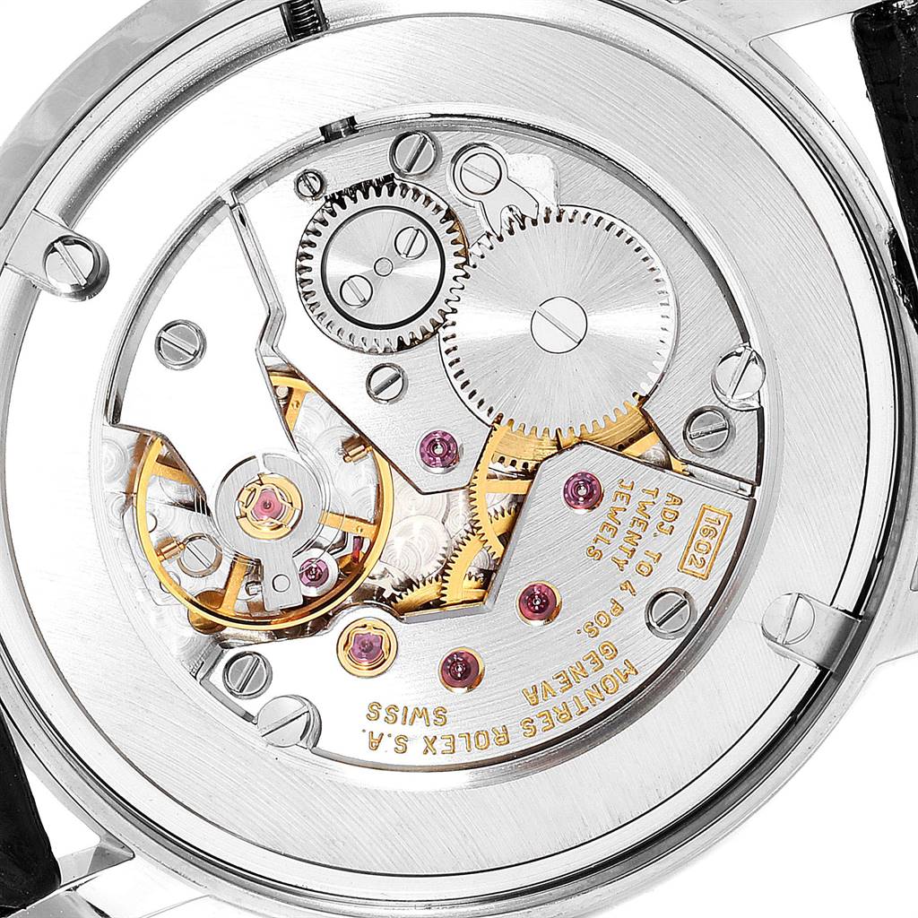 The image shows the movement and intricate internal components of a Rolex Cellini 5115 Men's White Gold Mother of Pearl Dial 5115 Men's White Gold Mother of Pearl Dial watch, viewed from the back.