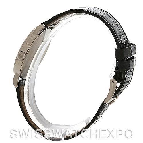 The image shows a side view of a Cellini model by Rolex, highlighting the black leather strap and clasp.