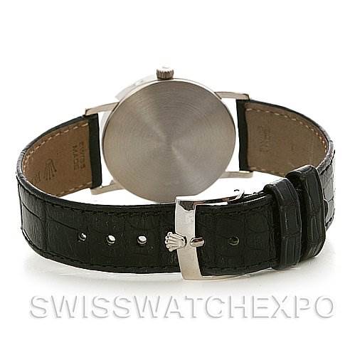 The image shows the back view of a Rolex Cellini 5115/9 White Gold Silver Dial 5115/9 White Gold Silver Dial watch, highlighting the case back and the leather strap with a clasp.