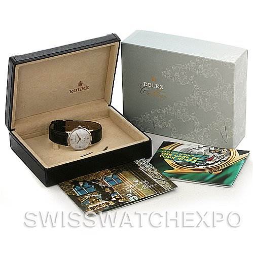 The image shows a Rolex Cellini 5115/9 White Gold Silver Dial 5115/9 White Gold Silver Dial watch and its box, along with related booklets displayed at an angle to show all components.