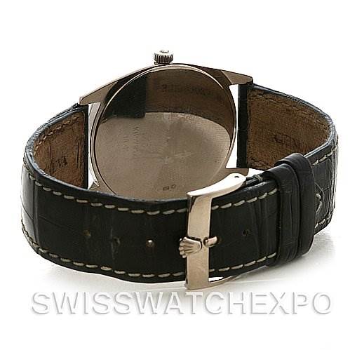 The image shows a rear view of a Rolex Cellini 4233 White Gold White Dial 4233 White Gold White Dial watch, highlighting its leather strap and buckle.