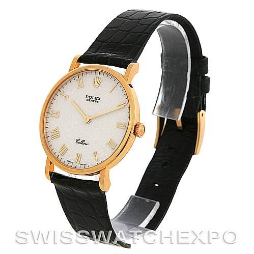 The image shows a side angle of a Rolex Cellini 5112 Yellow Gold Beige Dial 5112 Yellow Gold Beige Dial watch featuring its dial, case, crown, and leather strap.