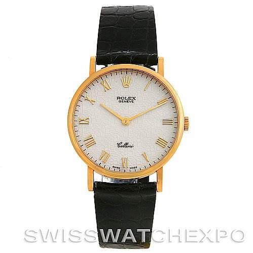 This image shows a frontal view of a Rolex Cellini 5112 Yellow Gold Beige Dial 5112 Yellow Gold Beige Dial watch with a gold case, white dial, Roman numeral markers, and a black leather strap.