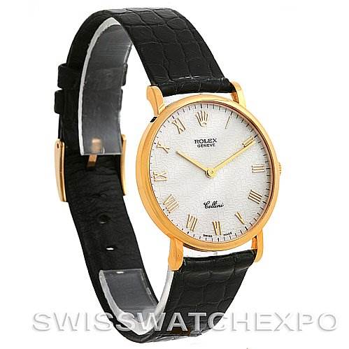 The image shows a Rolex Cellini 5112 Yellow Gold Beige Dial 5112 Yellow Gold Beige Dial watch at a three-quarter angle, highlighting its gold case, white dial, black leather strap, and Roman numeral hour markers.