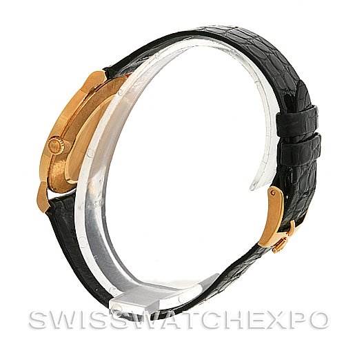 The image shows a Rolex Cellini 5112 Yellow Gold Beige Dial 5112 Yellow Gold Beige Dial watch from a side angle, highlighting its barrel, crown, and black leather strap.