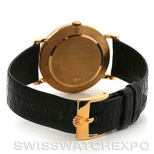 The image shows the back view of a Rolex Cellini 5112 Yellow Gold Beige Dial 5112 Yellow Gold Beige Dial model watch, featuring its case back, crown, and leather strap with a gold buckle.