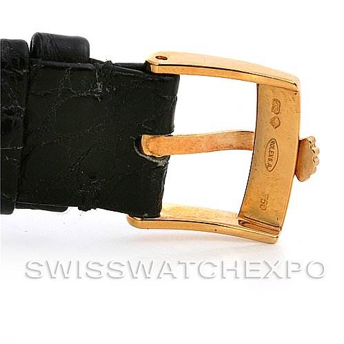 This image shows a close-up of the gold buckle and black leather strap of a Rolex Cellini 5112 Yellow Gold Beige Dial 5112 Yellow Gold Beige Dial watch.