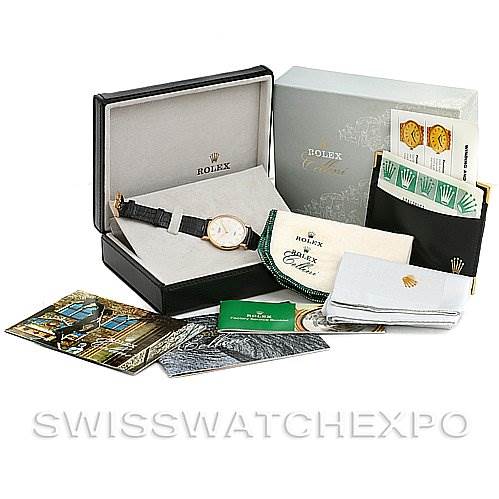 The image shows a Rolex Cellini 5112 Yellow Gold Beige Dial 5112 Yellow Gold Beige Dial watch set, including the watch, box, booklets, warranty cards, and cleaning cloths.