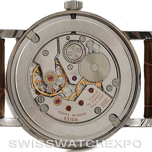 The image shows the back view of a Rolex Cellini 5115 White Gold Brown Dial 5115 White Gold Brown Dial watch, exposing its inner mechanical components and movement.