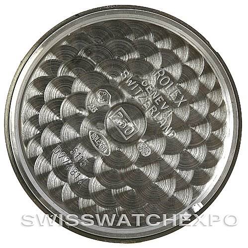 The image shows the inside case back of a Rolex Cellini 5115 White Gold Brown Dial 5115 White Gold Brown Dial watch with engraved details and patterns.