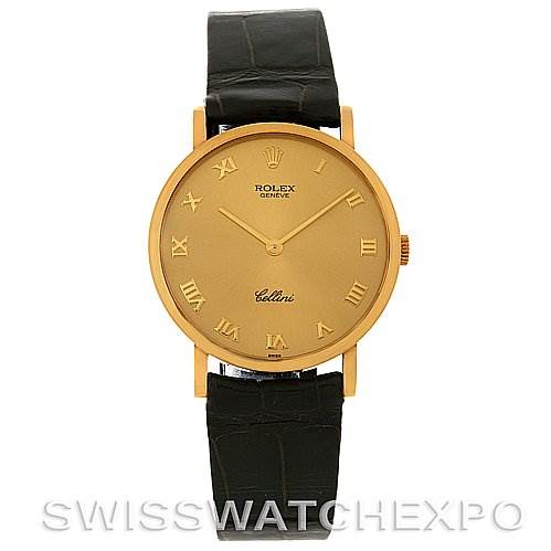 The image shows a front view of a Rolex Cellini 5112 Men's Yellow Gold Champagne Dial 5112 Men's Yellow Gold Champagne Dial watch, featuring a gold dial and black leather strap.