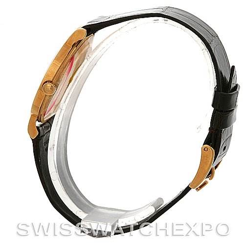 This side view of the Rolex Cellini 5112 Men's Yellow Gold Champagne Dial 5112 Men's Yellow Gold Champagne Dial watch shows its case, crown, and black leather strap with a deployant clasp.