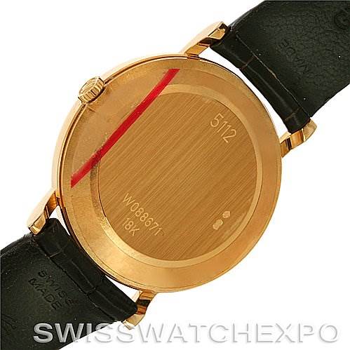 This image shows the back case of a Rolex Cellini 5112 Men's Yellow Gold Champagne Dial 5112 Men's Yellow Gold Champagne Dial watch, highlighting its serial number and "18K" gold marking.