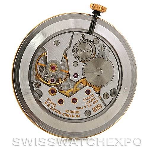 This image shows the movement of a Rolex Cellini 5112 Men's Yellow Gold Champagne Dial 5112 Men's Yellow Gold Champagne Dial watch, featuring gears, jewels, and the winding stem from a top-down angle.