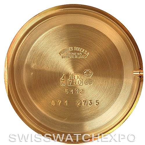 This image shows the inside of the case back of a Rolex Cellini 5112 Men's Yellow Gold Champagne Dial 5112 Men's Yellow Gold Champagne Dial watch, featuring various engravings and markings.