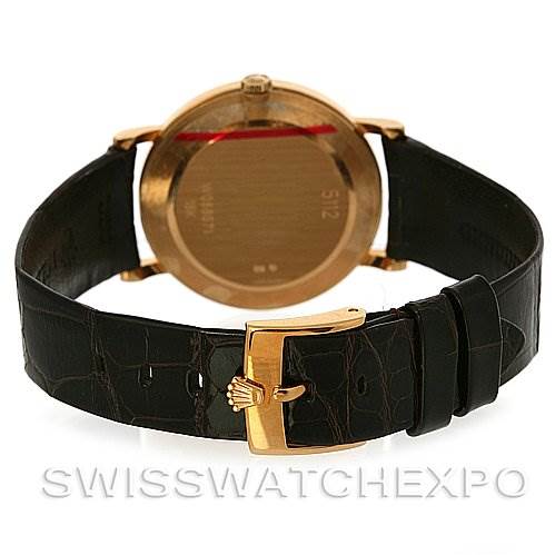 This image shows the back of a Rolex Cellini 5112 Men's Yellow Gold Champagne Dial 5112 Men's Yellow Gold Champagne Dial watch with a black leather strap and gold clasp, taken from a rear angle.