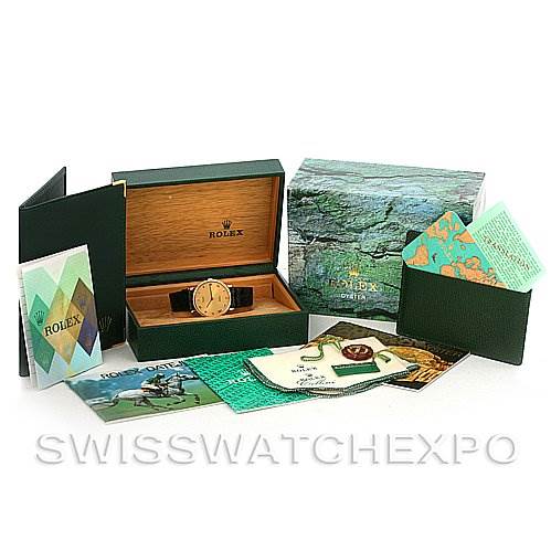 The image shows a Rolex Cellini 5112 Men's Yellow Gold Champagne Dial 5112 Men's Yellow Gold Champagne Dial watch placed inside its box, along with its packaging and various booklets.