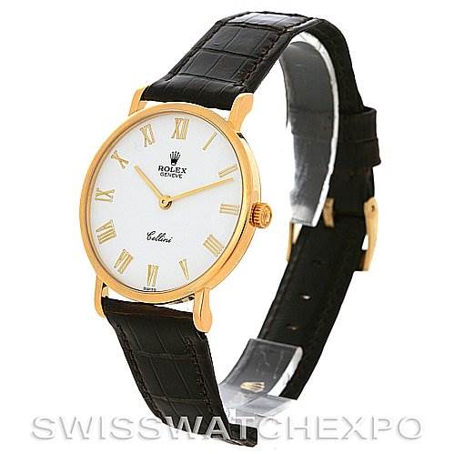 The image shows a Rolex Cellini 5112 Yellow Gold  5112 Yellow Gold  watch at a three-quarter angle, highlighting its gold case, white dial with Roman numerals, and black leather strap.