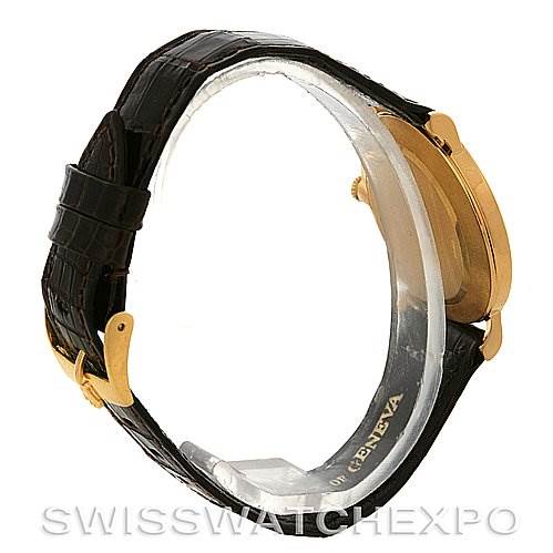 The image shows a Rolex Cellini 5112 Yellow Gold  5112 Yellow Gold  watch from a side angle, highlighting its leather strap and the side of its gold case.