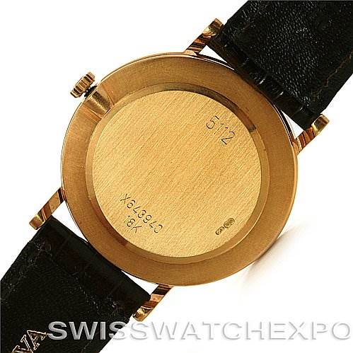 This image shows the back view of a Rolex Cellini 5112 Yellow Gold  5112 Yellow Gold  watch, highlighting its gold case and black leather strap.