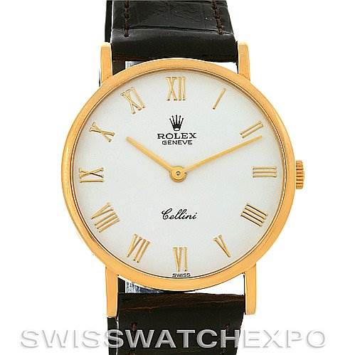 This image shows a front view of a Rolex Cellini 5112 Yellow Gold  5112 Yellow Gold  watch, featuring its dial, case, and part of the leather strap.