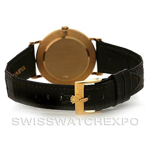 This image shows the rear view of the Rolex Cellini 5112 Yellow Gold  5112 Yellow Gold  watch, highlighting its golden clasp and leather strap.