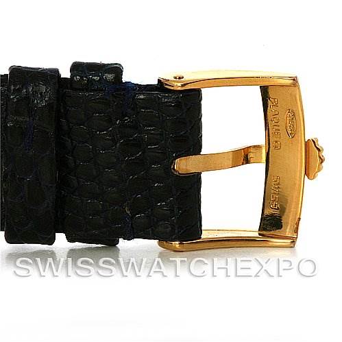 The image shows a close-up angle of the lizard strap with the gold buckle of a Rolex Cellini 4012 Men
s Yellow Gold Blue Dial 4012 Men
s Yellow Gold Blue Dial watch.