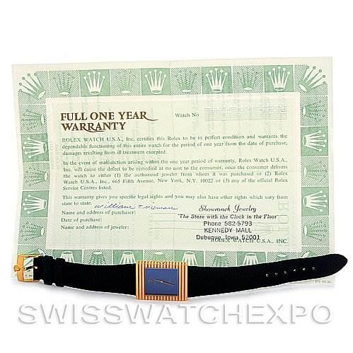 The image shows a Rolex Cellini 4012 Men
s Yellow Gold Blue Dial 4012 Men
s Yellow Gold Blue Dial watch laid flat, displaying the watch face, strap, and buckle, along with a warranty card in the background.